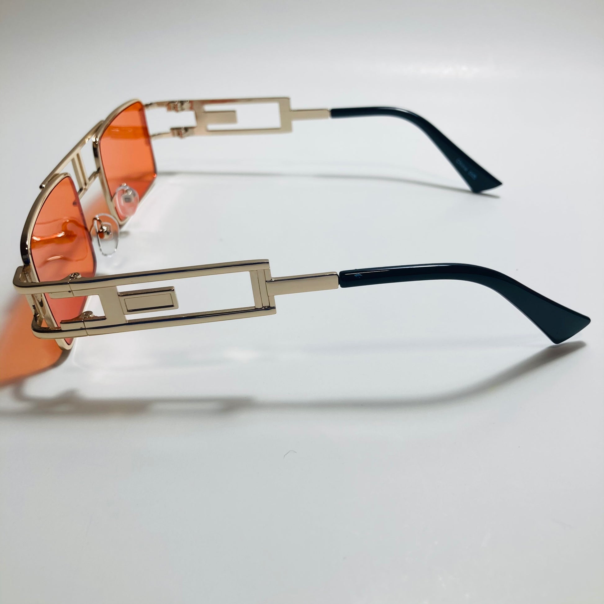 mens and womens red and gold square sunglasses
