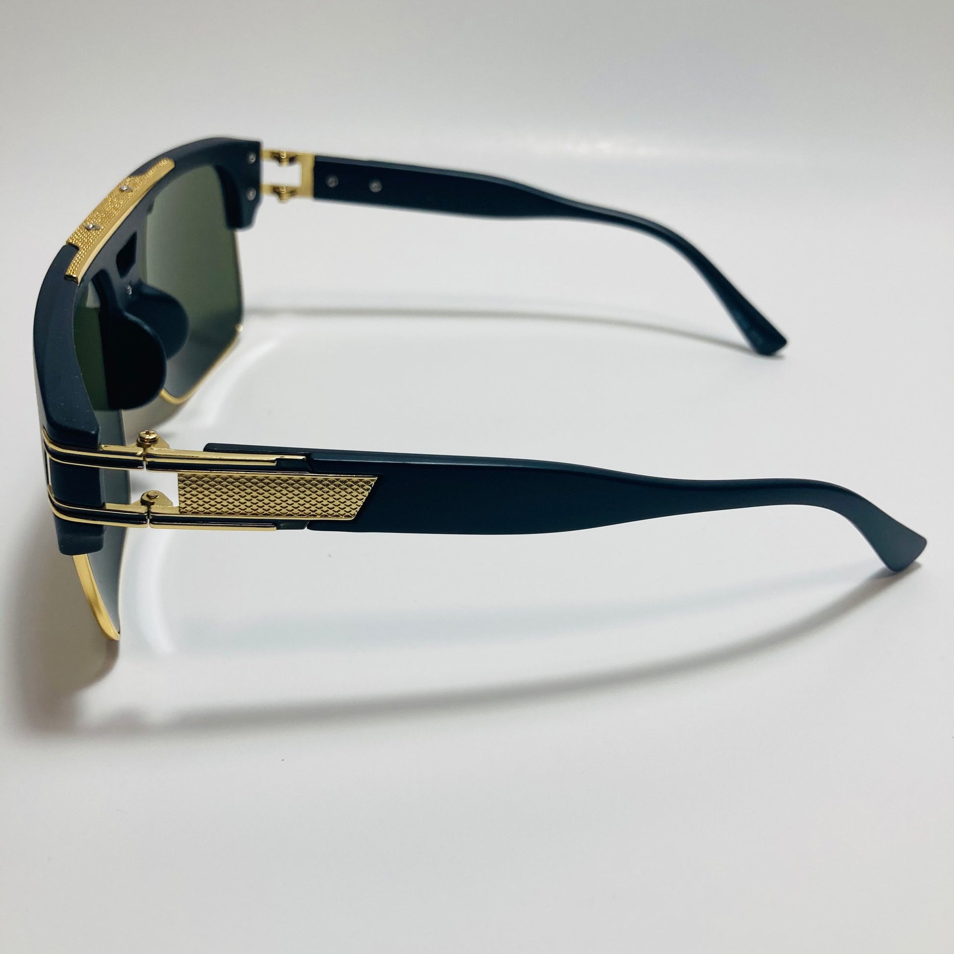 black, green, and gold gazelle sunglasses