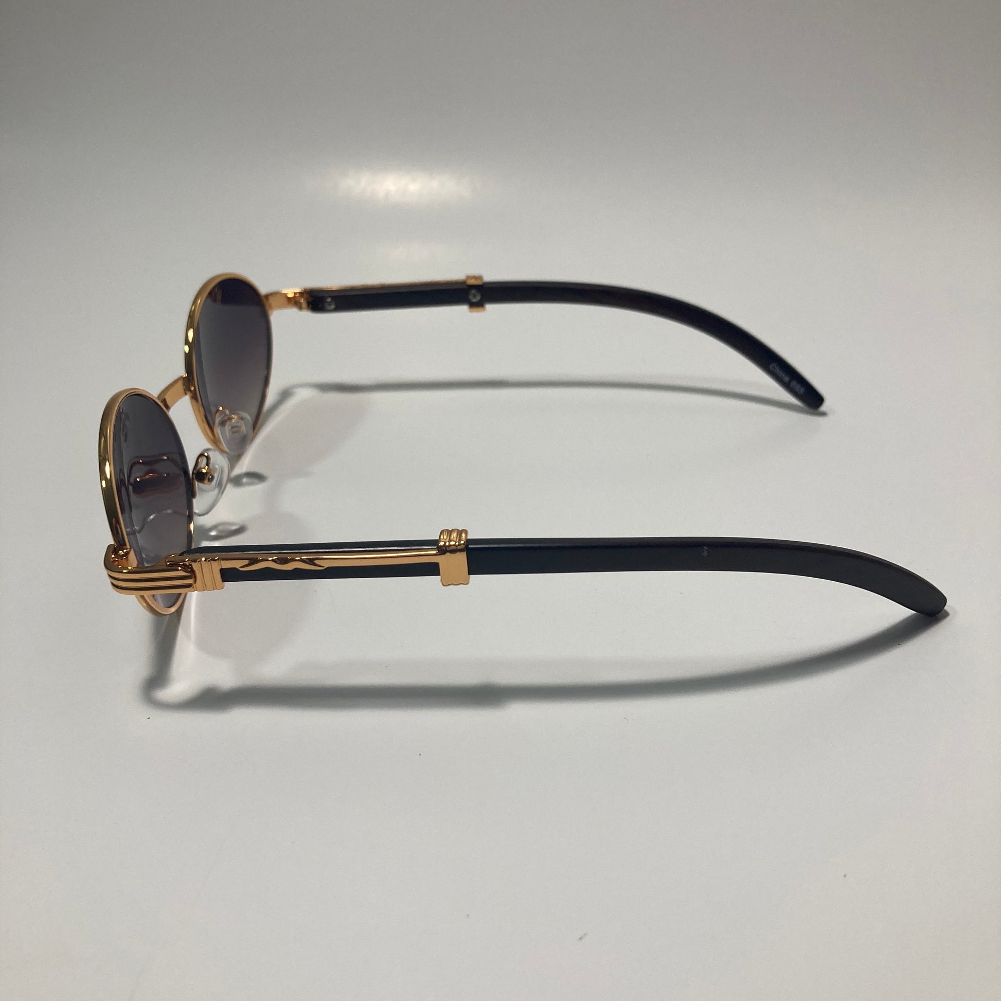 mens and womens brown and gold round sunglasses