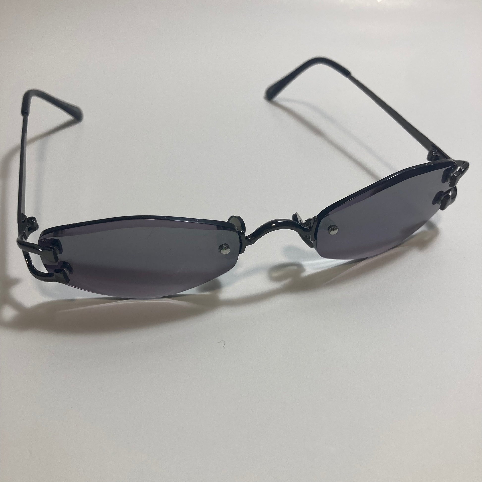 mens and womens black small rimless sunglasses