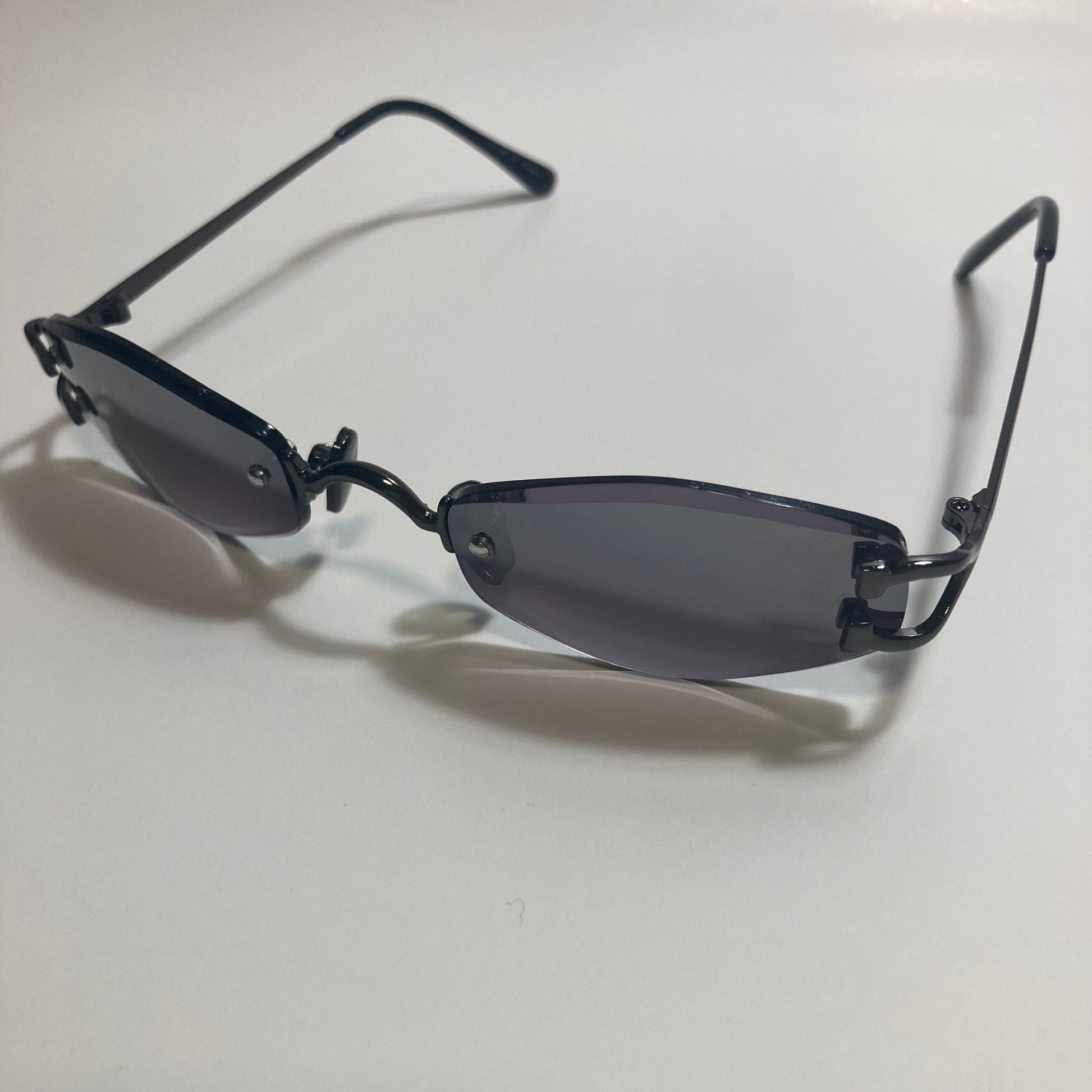 mens and womens black small rimless sunglasses