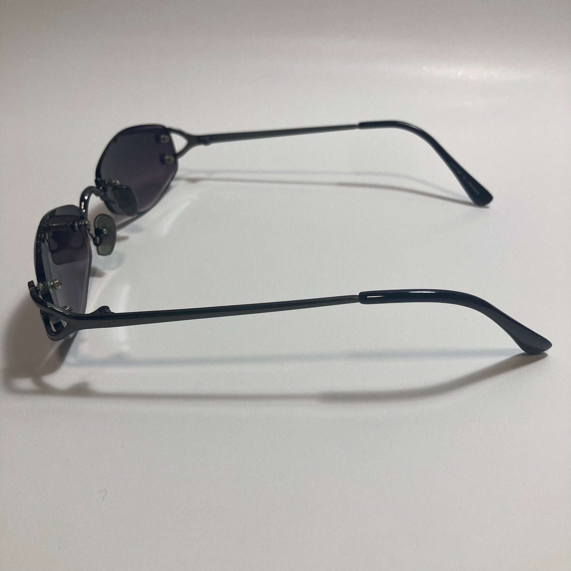 mens and womens black small rimless sunglasses