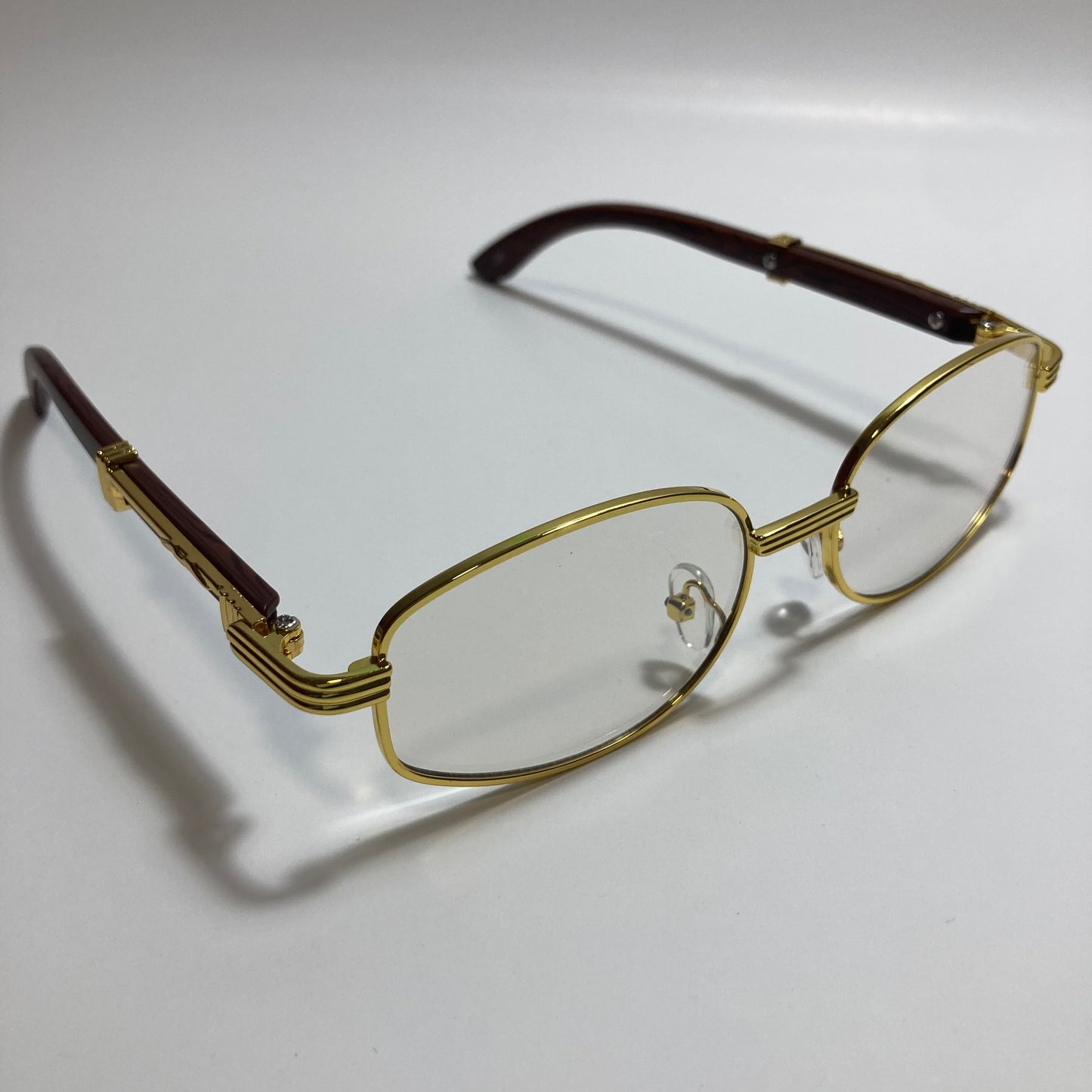 mens and womens clear and gold oval sunglasses