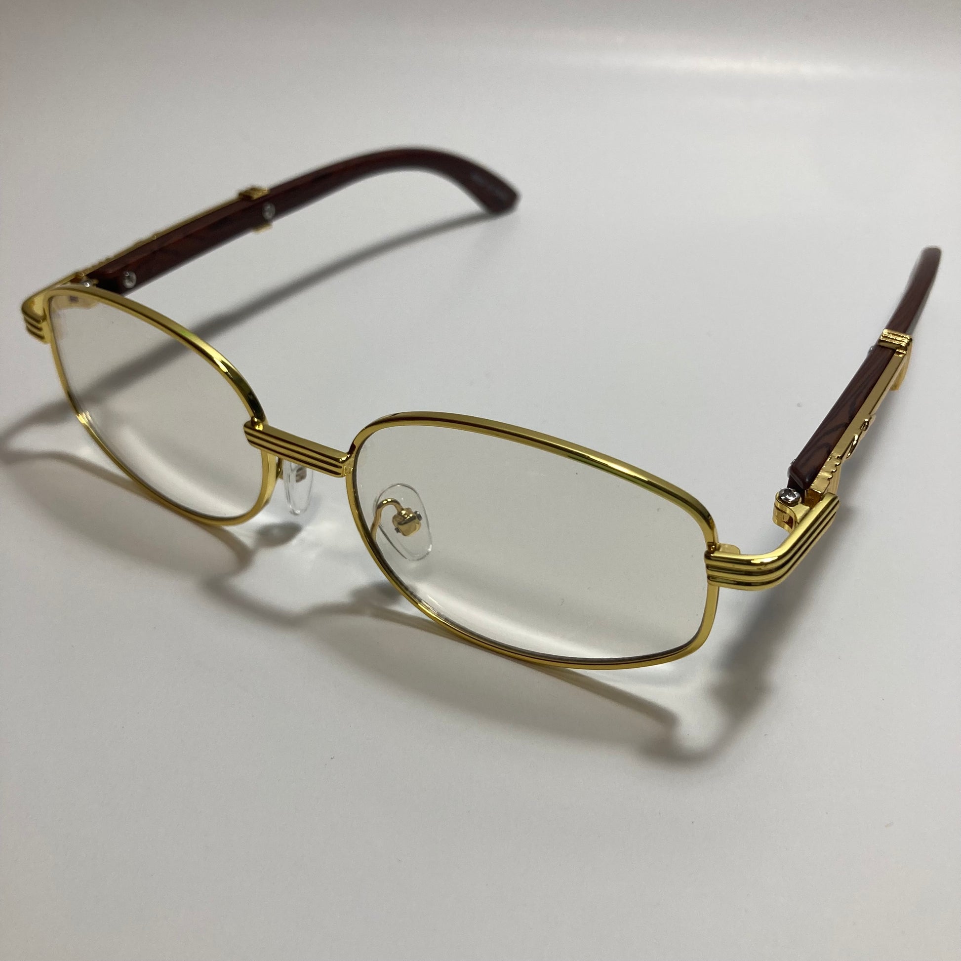 mens and womens clear and gold oval sunglasses