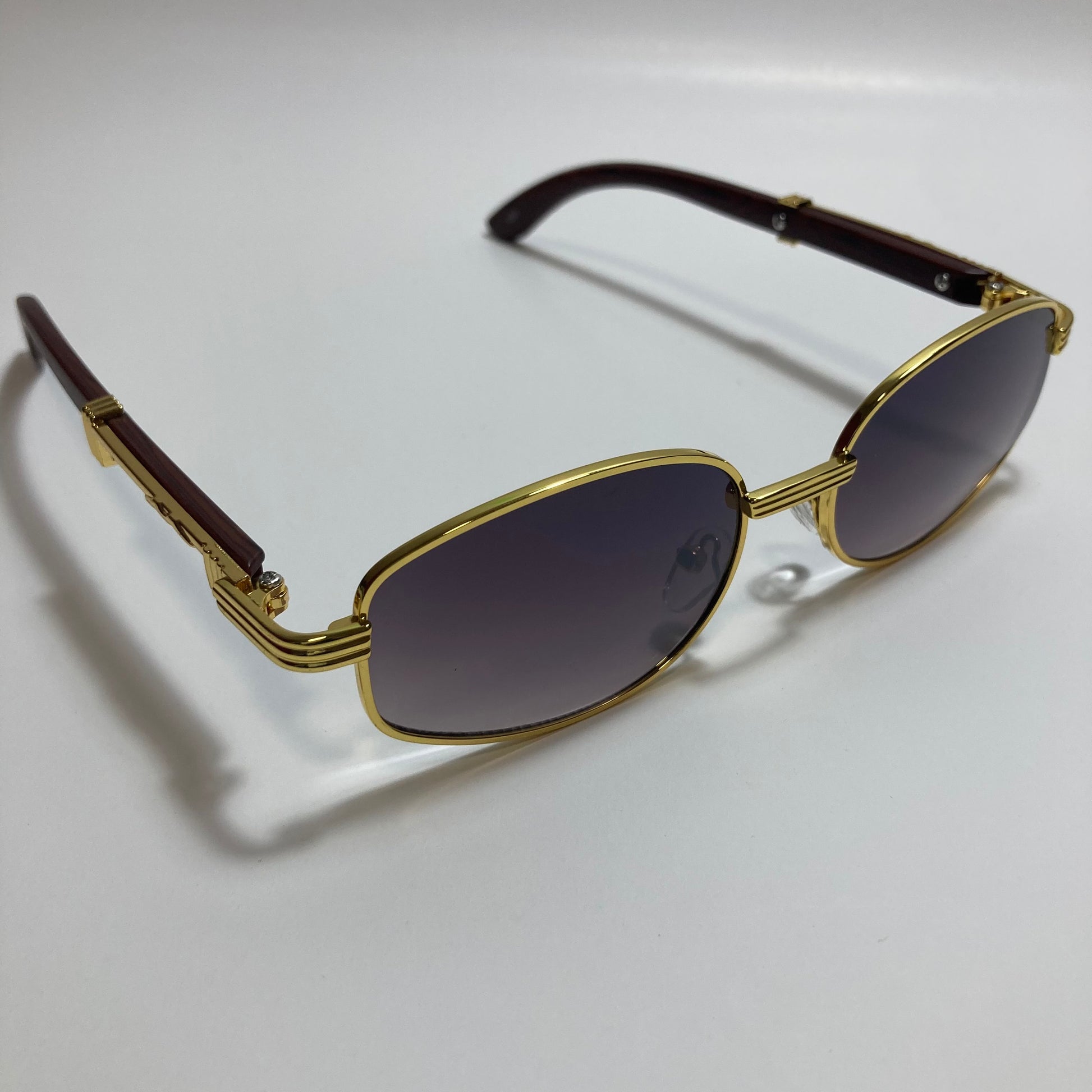 mens and womens black and gold oval sunglasses