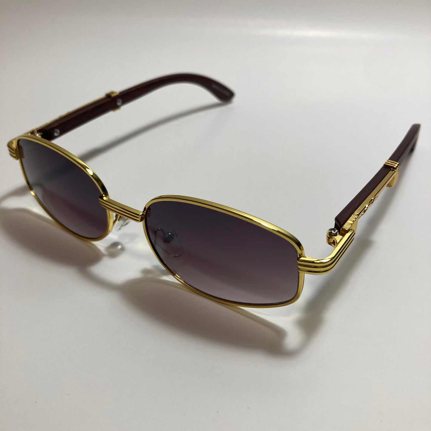 mens and womens black and gold oval sunglasses