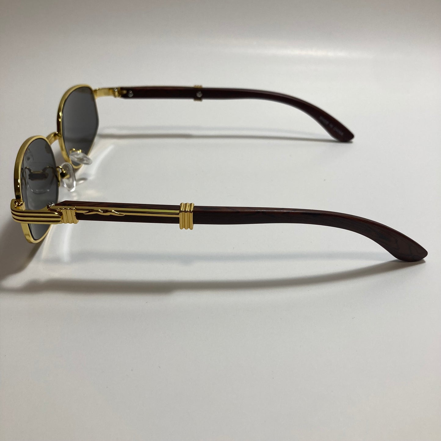 mens and womens black and gold oval sunglasses