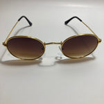 mens and womens small gold round sunglasses with brown lenses 