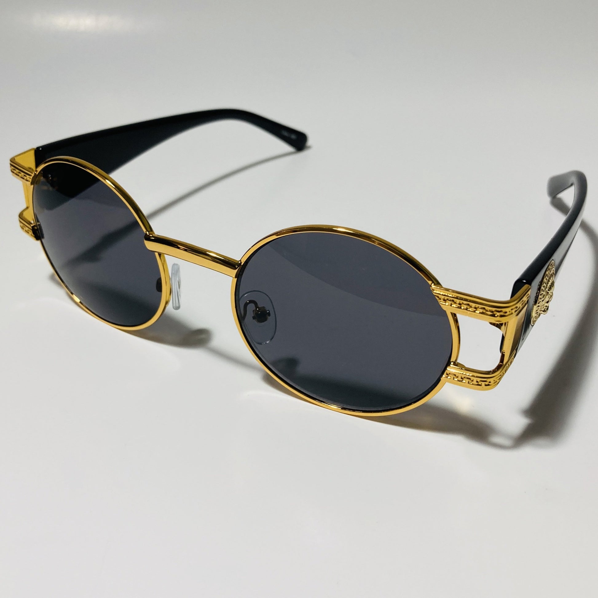 mens and womens black and gold round sunglasses
