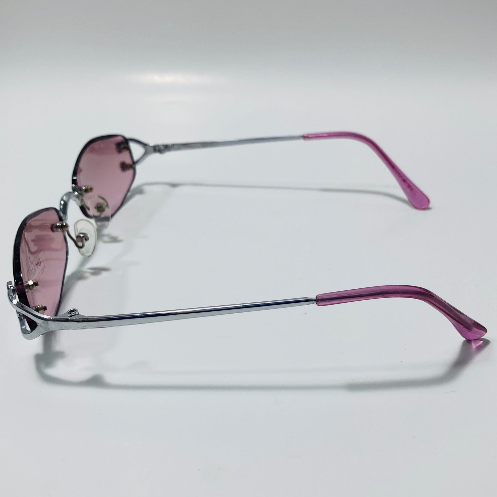 mens and womens silver and purple small rimless sunglasses