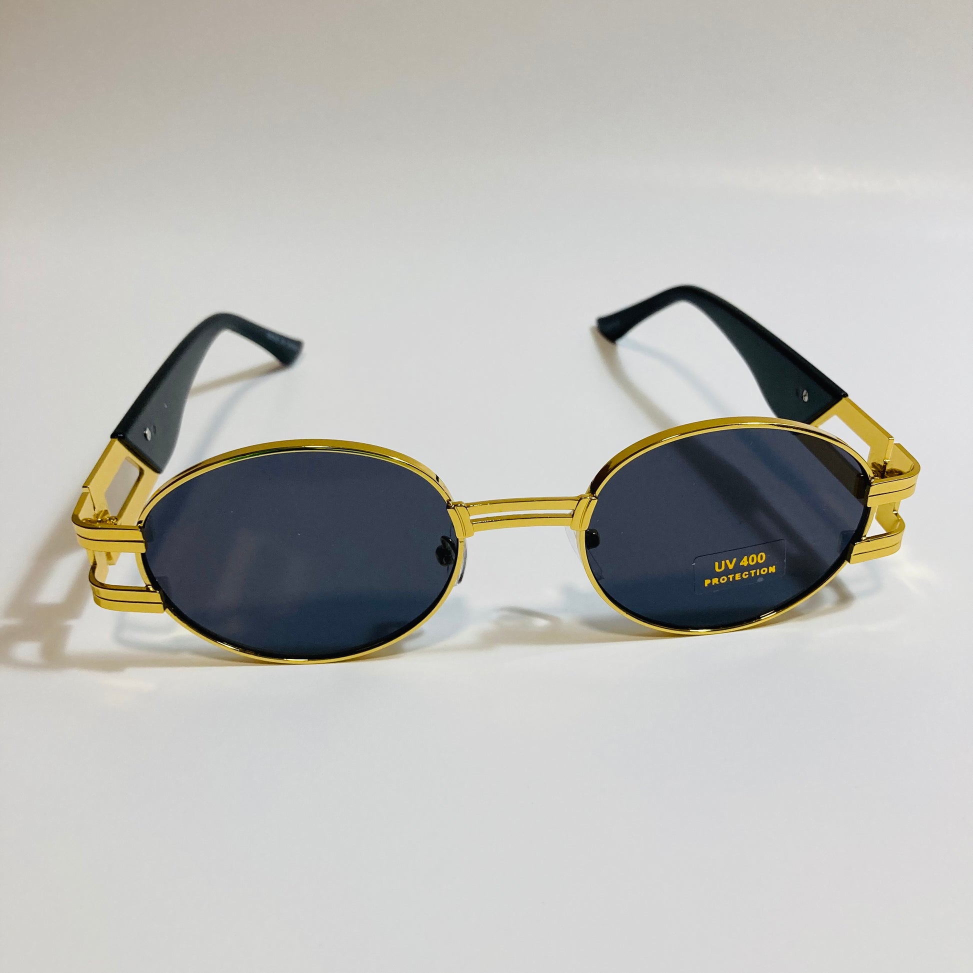 mens and womens gold and black round sunglasses